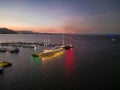 Night time sunset drone shot boat docked at Cairns Marina and Esplanade