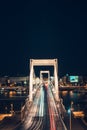 Night time traffic over the Elisabeth bridge. It crosses Danube river and connect Buda and Pest together. Budapest, Hungary Royalty Free Stock Photo