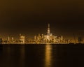 Night-time view of lower New York City with reflections on the Hudson River. Royalty Free Stock Photo