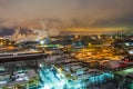 Night top view of a steel mill. Smog, smoke and flame from the chimneys. Industrial zone Royalty Free Stock Photo