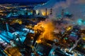 Night top view of a steel mill. Smog, smoke and flame from chimneys. Metallurgical blast furnace in lights and smoke Royalty Free Stock Photo