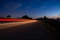 night track with blurred lights from the headlights of cars.long exposure time. Royalty Free Stock Photo