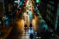 Night traffic in Bangkok. Street in the city center filled with cars passenger buses bikes and taxis. Night city lights up. Royalty Free Stock Photo