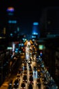 Night traffic in Bangkok. Street in the city center filled with cars passenger buses bikes and taxis. Night city lights up Royalty Free Stock Photo