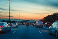 Night traffic, cars on highway road on sunset evening night in busy city Royalty Free Stock Photo