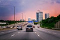 Cars on highway road at sunset evening in typical busy american Canadian  city Royalty Free Stock Photo