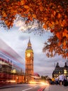 Night traffic jam with autumn leaves against Big Ben in London, England, UK Royalty Free Stock Photo