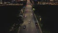 Night traffic movement at the center of big city, aerial urban view. Shot. Aerial view of night road with moving cars Royalty Free Stock Photo