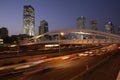 Night traffic in Tel Aviv. modern metal bridge in the city in the downtown over the highway and railway. concept of modern enginee Royalty Free Stock Photo