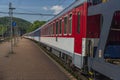 Night train with sleeping coaches and car motorcycle coaches Kysak station Royalty Free Stock Photo