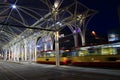 Night tram riding around night city. Modern tram going in evening city