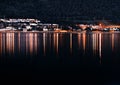 Night Tromso community with lights reflections background Royalty Free Stock Photo