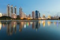 Night twilight city office building with water reflection in public park Royalty Free Stock Photo