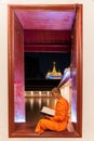 Night Urban City Skyline of Landmark Bangkok. Wat Saket. Night scene of Phu Khao Thong Golden Mountain and monk reading a book Royalty Free Stock Photo