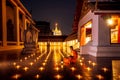 Night Urban City Skyline of Landmark Bangkok. Wat Saket. Night scene of Phu Khao Thong Golden Mountain and monk reading a book Royalty Free Stock Photo