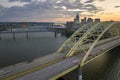 Night urban landscape of downtown district of Cincinnati city in Ohio, USA. Skyline with driving cars on bridge and Royalty Free Stock Photo