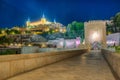 Night view of Alcantara bridge over river Tajo with Alcazar castle at background at Toledo, Spain Royalty Free Stock Photo