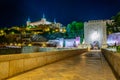 Night view of Alcantara bridge over river Tajo with Alcazar castle at background at Toledo, Spain Royalty Free Stock Photo