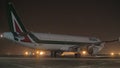 Night view of Alitalia plane in Sheremetyevo Airport, Moscow Royalty Free Stock Photo