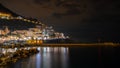 Night view of Amalfi cityscape on coast of mediterranean sea, Italy