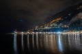 Night view of Amalfi cityscape on coast of mediterranean sea, Italy