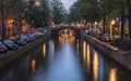 Night view of Amsterdam cityscape with canal, bridge and typical Dutch Houses. Amsterdam, Netherlands Royalty Free Stock Photo