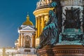 Night view of the ancient statues of stucco and the dome of St. Isaac`s Cathedral Petersburg. Royalty Free Stock Photo