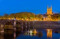 Night view of Angers with Verdun Bridge and Saint Maurice Cathedral - France