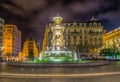 Night view of a beautiful marble fountain on Place des Jacobins in Lyon, France