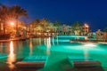 Night view of Beautiful swimming pool and palm trees in Egypt Royalty Free Stock Photo