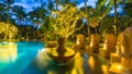 Night view of beautiful swimming pool in tropical resort , Thailand Royalty Free Stock Photo