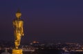 Night view of big public big golden buddha statue standing in Wat Phra That Kao Noi at Nan province Thailand Royalty Free Stock Photo