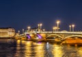 Night view of Blagoveshchensky drawbridge with an evening of multi-colored changing illumination. Saint Petersburg,