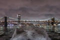 Night view of the Brooklyn Bridge, Manhattan Bridge and the Williamsburg Bridge from the East River Royalty Free Stock Photo