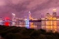 Night view of the bund at a cloudy day after raining with golden light in Shanghai, China Royalty Free Stock Photo