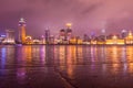 Night view of the bund at a cloudy day after raining with golden light in Shanghai, China Royalty Free Stock Photo