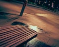 Night view of bus stop bench in dimmed lightings after midnight.