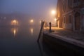 Night view canal on Murano island in the fog