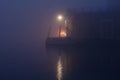 Night view canal on Murano island in the fog