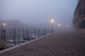 Night view canal on Murano island in the fog