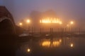 Night view canal on Murano island in the fog