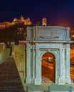 Night view of cathedral of San Ciriaco behind Arco di Traiano in Royalty Free Stock Photo