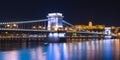 Night view of the Chain Bridge Lions Bridge reflected in the Danube river, Budapest Royalty Free Stock Photo