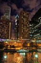 Night view of Chicago skyline with canal cruise on the river Royalty Free Stock Photo