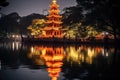 Night view of the Chinese pagoda at the lake in Hangzhou, China, Tran Quoc pagoda in Ha Noi capital of Vietnam, AI Generated