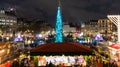 London, UK/Europe; 20/12/2019: Night view of Christmas market, Christmas tree and menorah in Trafalgar Square in London. Long