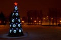 Night view of a Christmas tree near the Palace of Sports. Royalty Free Stock Photo