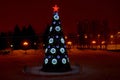 Night view of a Christmas tree near the Palace of Sports. Royalty Free Stock Photo