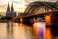 Cologne Cathedral and Hohenzollern Bridge at sunset, Germany Royalty Free Stock Photo