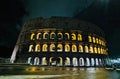 Night view of Colosseum with illuminating lights under dark sky in Rome, Italy Royalty Free Stock Photo